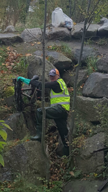 Removing a child's bike from Whitestown Stream